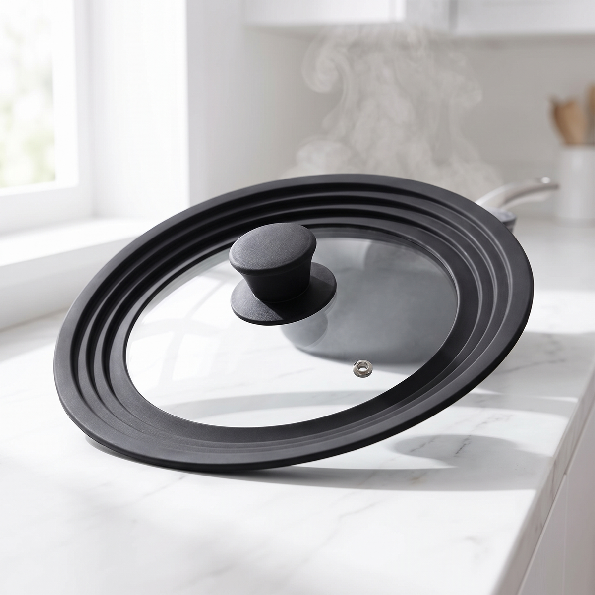 Universal Kitchen Lid - tempered glass lid with black silicone ridges on a marble counter