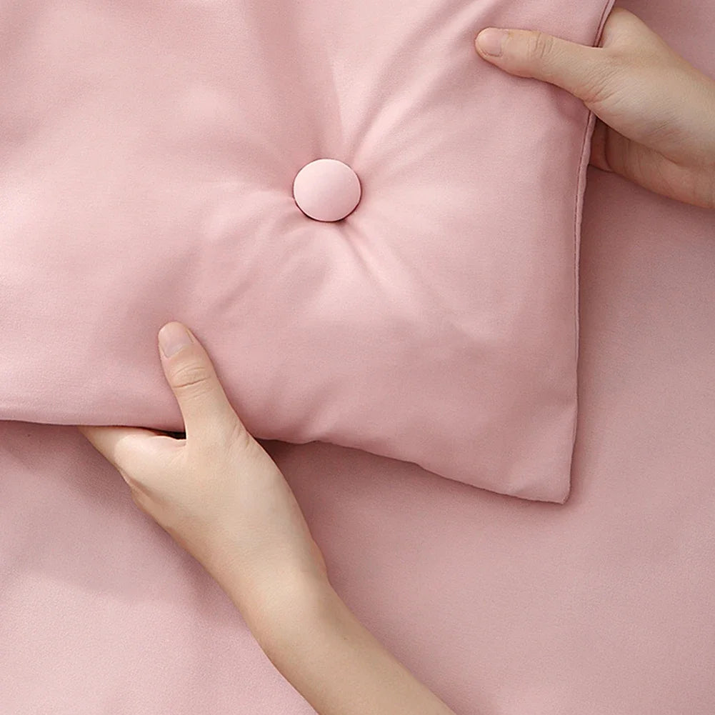Duvet clip locked through a duvet corner creating a neat tufted button look