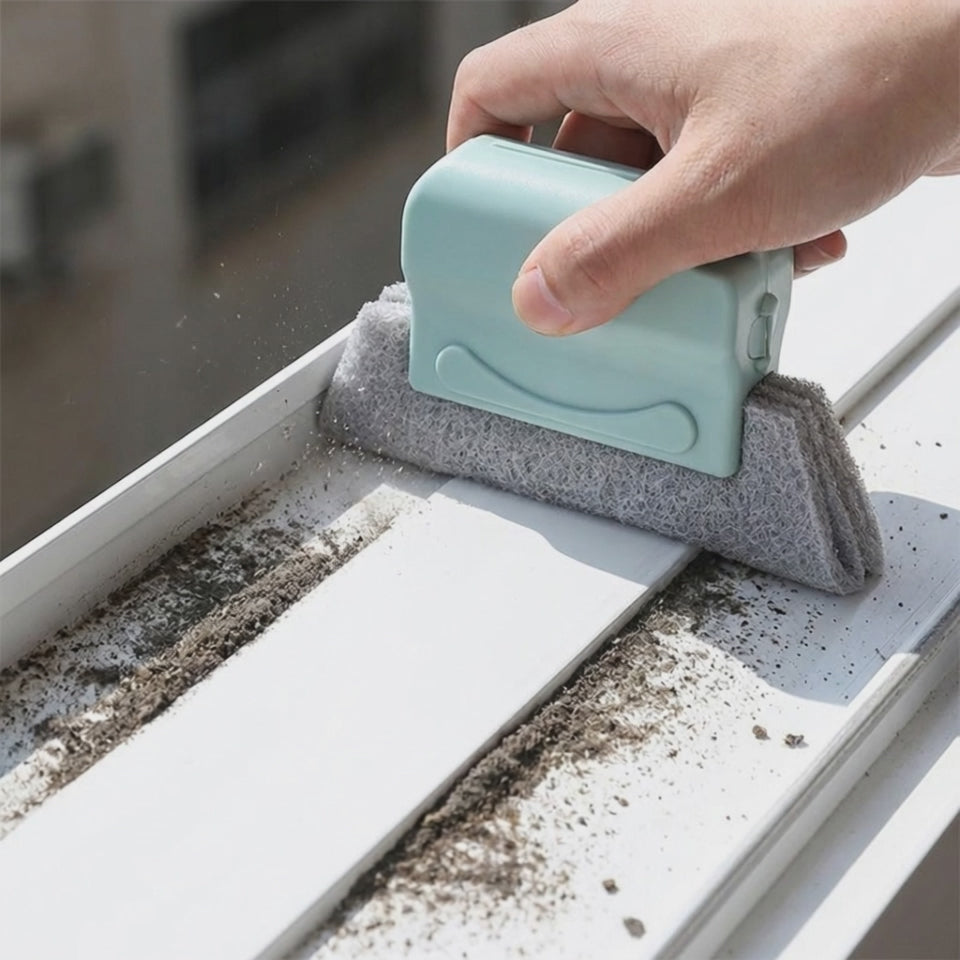 Gliding the track cleaner brush along a window track
