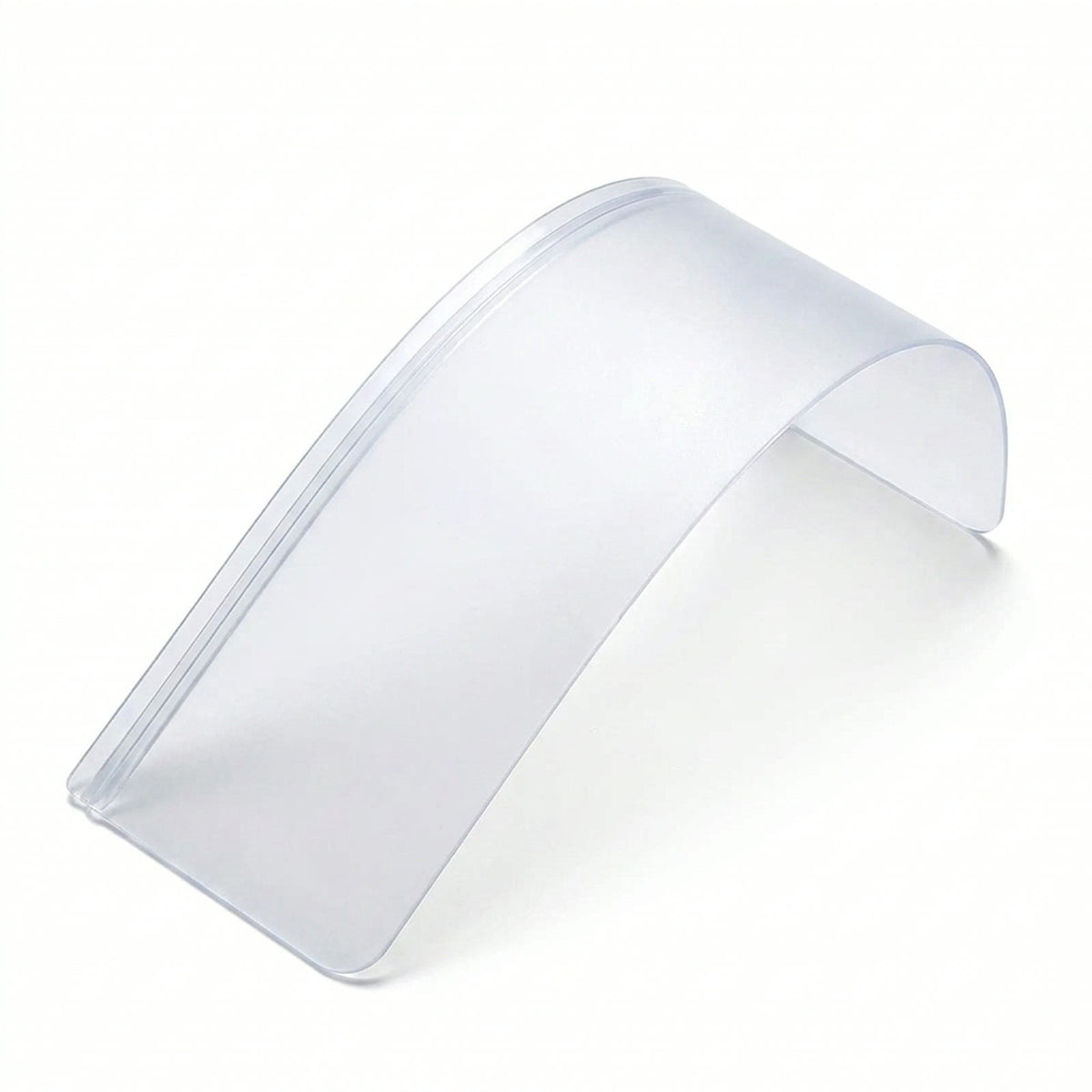 Frosted flexible toilet splash guard strip with adhesive edge on white background