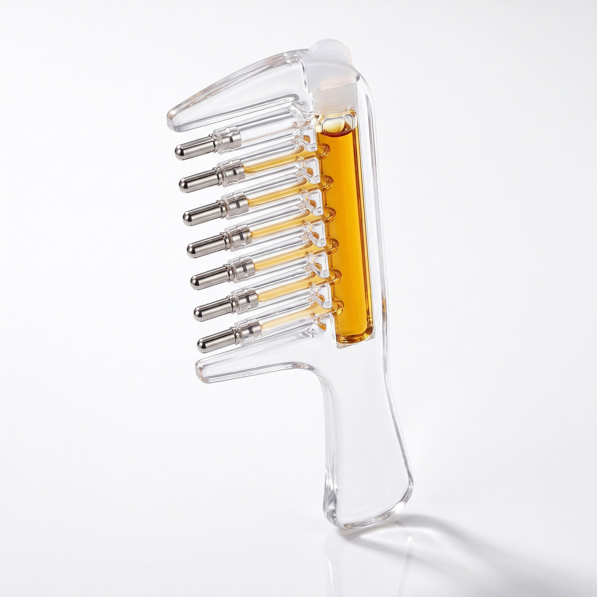Scalp Serum Applicator Comb standing upright, clear body and seven steel roller balls