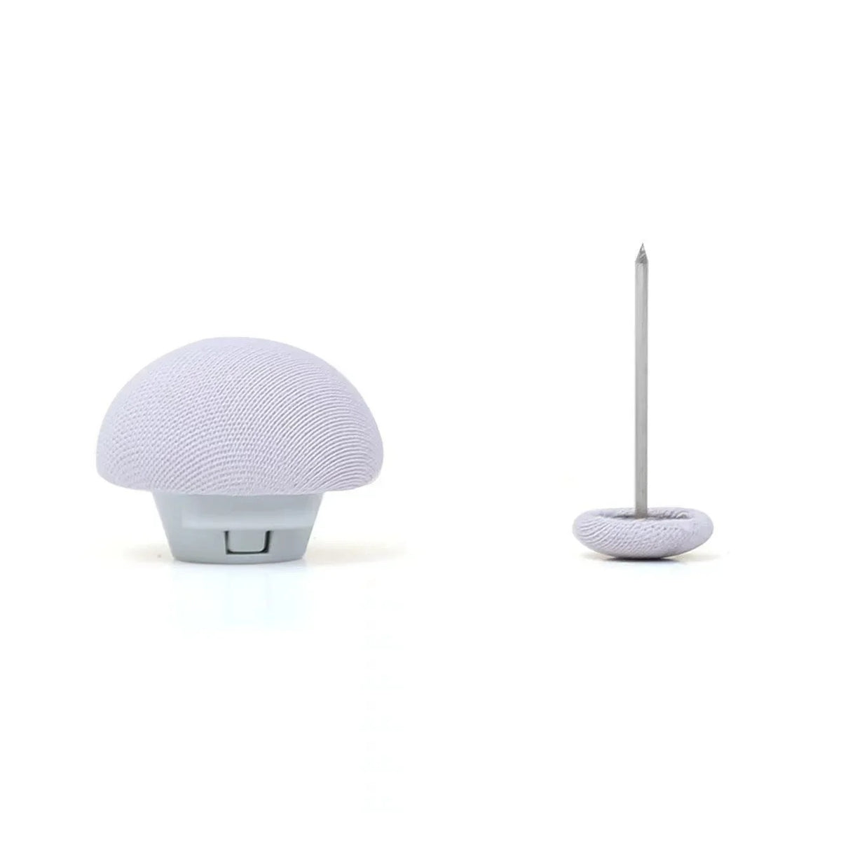 Grey Stay-Put Duvet Clip showing the padded locking cap and the pin base side by side