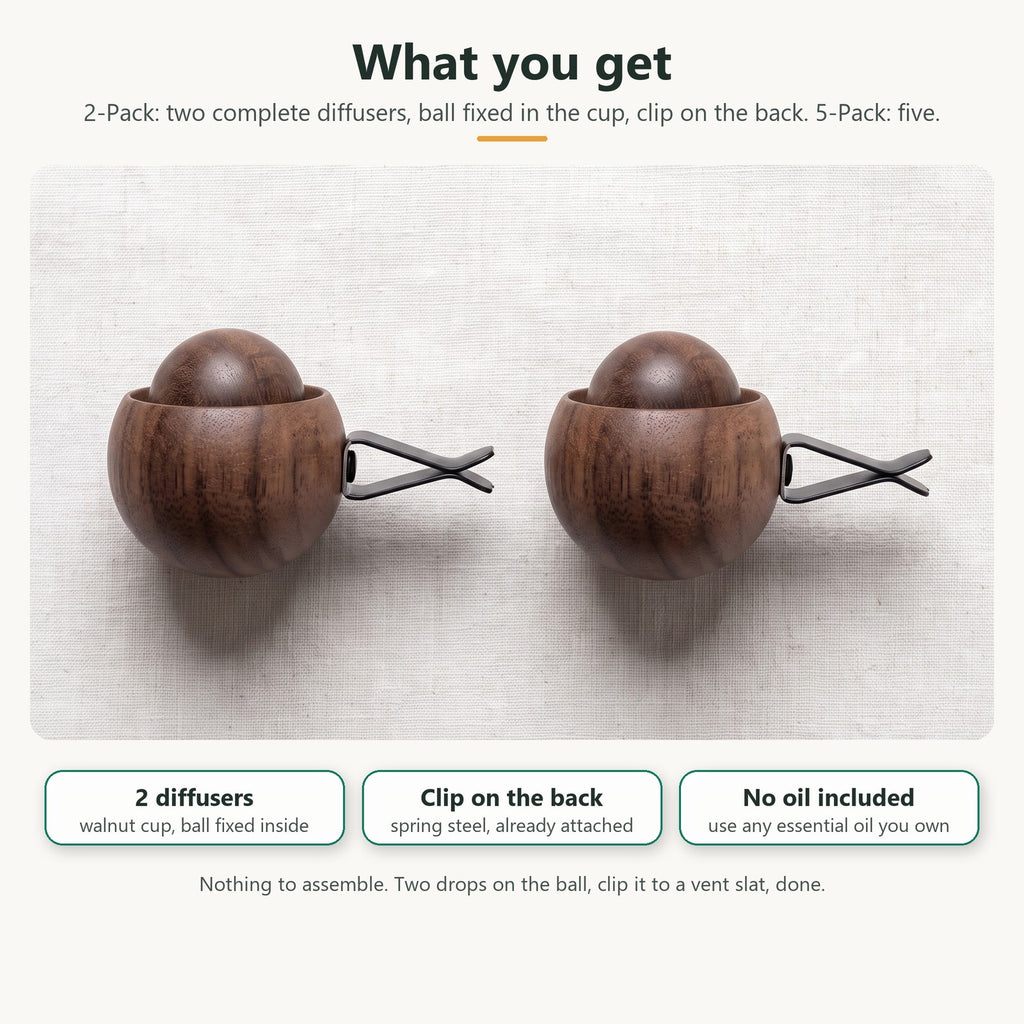 What you get in the 2-Pack: two complete wooden diffusers, each a walnut cup with the wood ball fixed inside and a spring clip on the back; no oil included