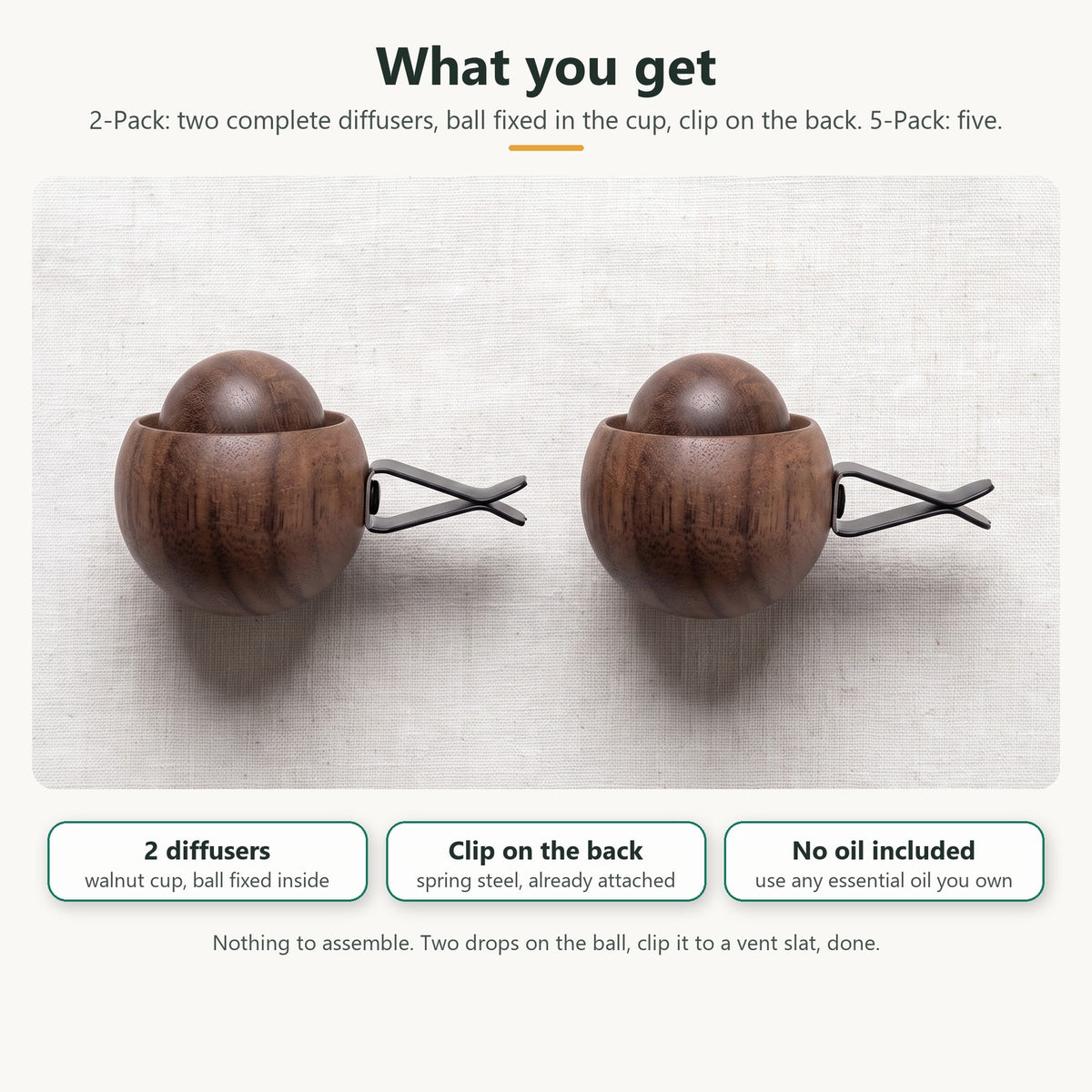 What you get in the 2-Pack: two complete wooden diffusers, each a walnut cup with the wood ball fixed inside and a spring clip on the back; no oil included